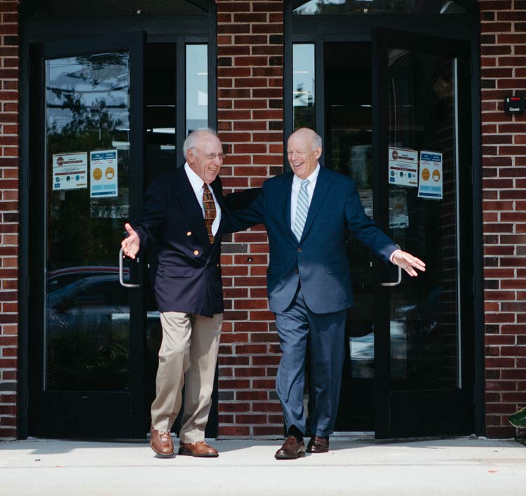Attorneys Richard S. Mittleman and E. Colby Cameron at the entrance to the building
