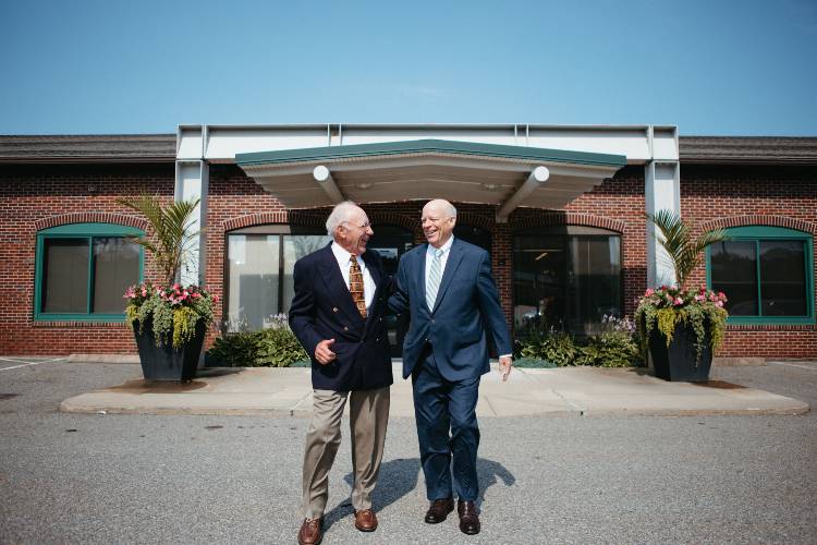 Attorneys Richard S. Mittleman and E. Colby Cameron outside entrance to office